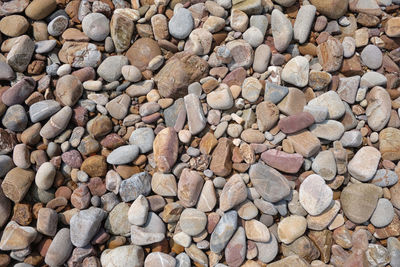 High angle view of stones on pebbles