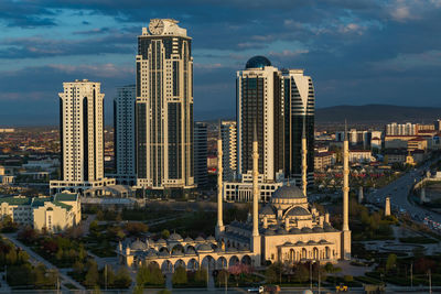 Modern buildings in city against sky