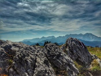 Rock formations on landscape against sky