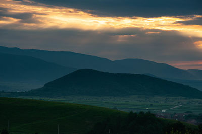 Scenic view of mountains against sky during sunset