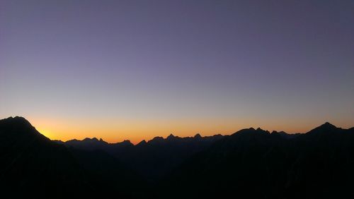 Scenic view of mountains at sunset