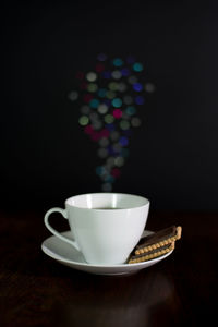 Close-up of coffee cup on table