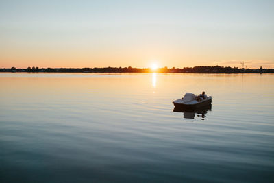 Scenic view of lake against sky during sunset