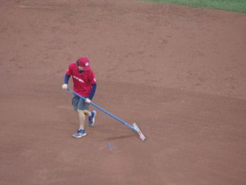 High angle view of man playing with umbrella