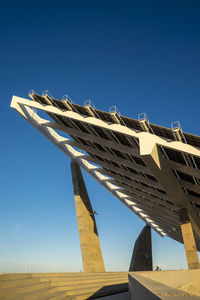 Low angle view built structure against clear blue sky