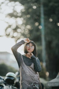 Portrait of young woman standing outdoors