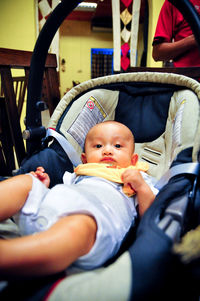 Portrait of cute boy relaxing in stroller