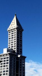 Low angle view of building against blue sky