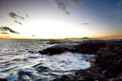 Scenic view of sea against sky during sunset