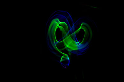 Close-up of light painting against black background