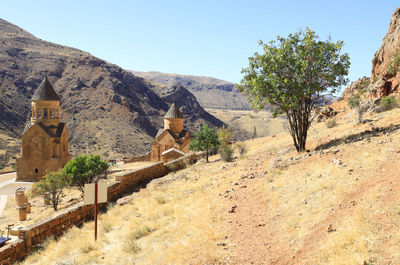 Scenic view of trees and mountains against clear sky