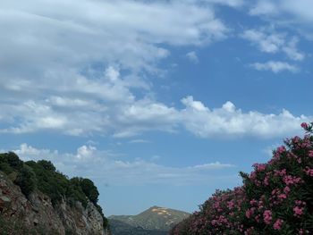 Scenic view of mountains and buildings against sky