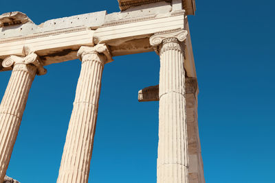 Low angle view of historic building against blue sky