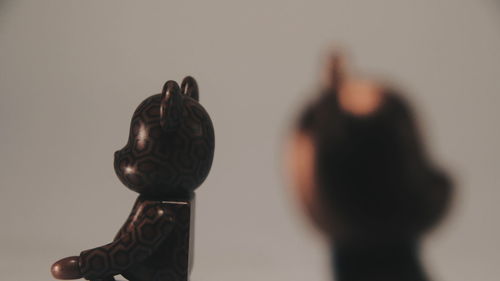 Close-up of statue against black background