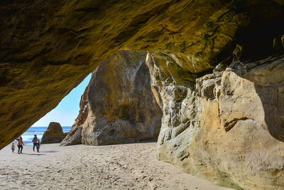 Scenic view of rock formations at beach