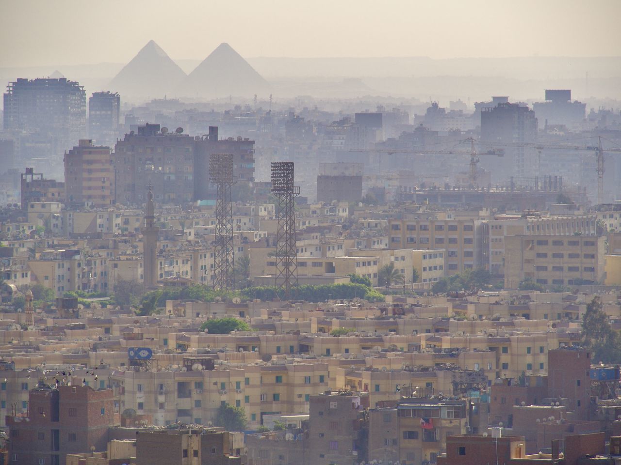 HIGH ANGLE VIEW OF BUILDINGS AGAINST SKY