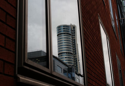 Low angle view of modern buildings against sky