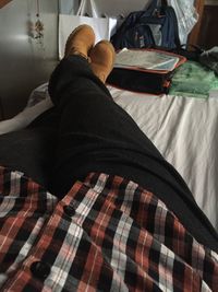 Low section of man relaxing on bench