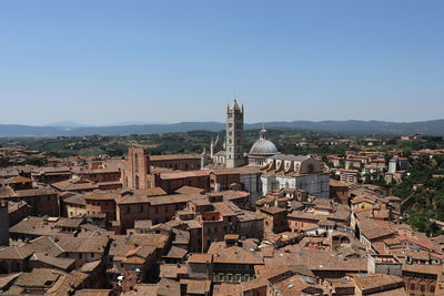 Aerial view of townscape against clear sky