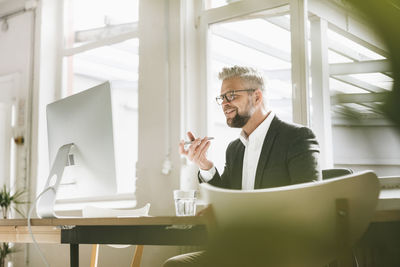 Businessman working in office using computer