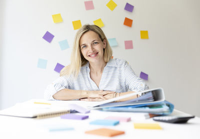 Portrait of businesswoman sitting at office