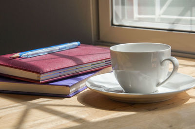 Close-up of coffee cup on table