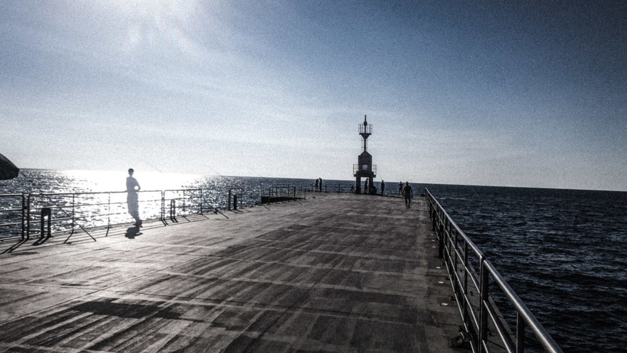 sea, water, horizon over water, sky, lifestyles, leisure activity, the way forward, pier, tranquility, tranquil scene, scenics, nature, beauty in nature, outdoors, tourist, cloud - sky, idyllic, day, vacations, tourism, cloud, travel destinations