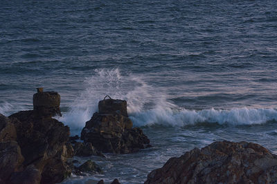 Waves splashing on rocks at shore