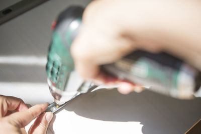 Close-up of man holding work tool