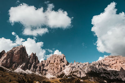 Low angle view of rocks against sky