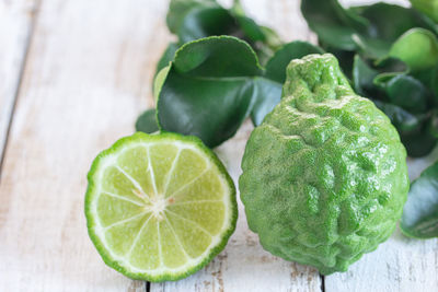 High angle view of fresh bergamot on wooden table with copy space 