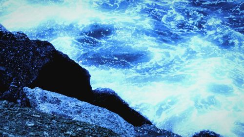 Waves splashing on rocks