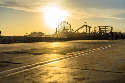 View of ferris wheel at sunset