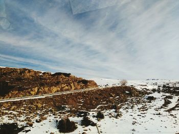 Scenic view of landscape against sky during winter