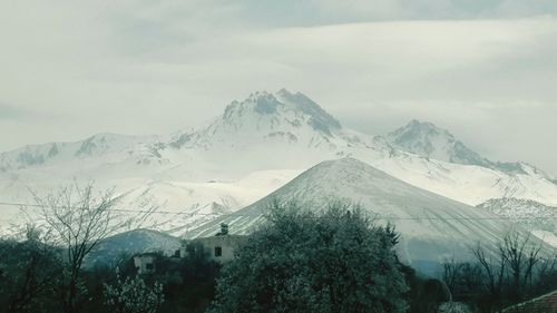 Scenic view of snowcapped mountains against sky