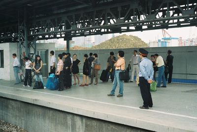 Group of people at railroad station platform