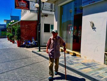 Full length of man standing on road