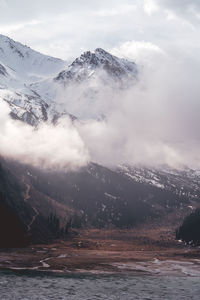 Scenic view of snowcapped mountains against sky