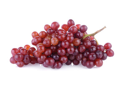 Close-up of grapes against white background