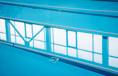 Low angle view of bridge against blue sky
