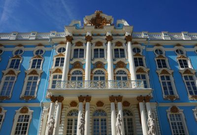 Low angle view of historical building against blue sky
