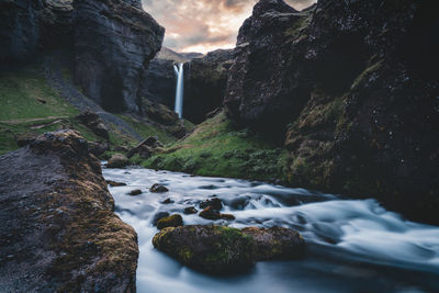 Scenic view of stream flowing through rocks