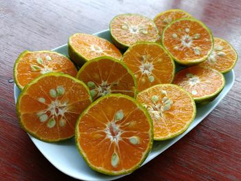 High angle view of sliced oranges on table