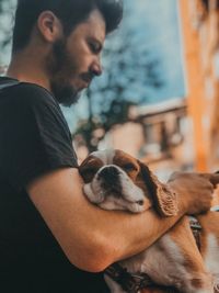 Side view of man with dog