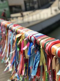 Colorful ribbons hanging on railing