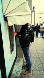 Woman standing on city street