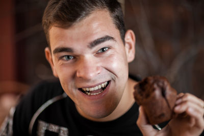 Close-up portrait of happy man holding baby