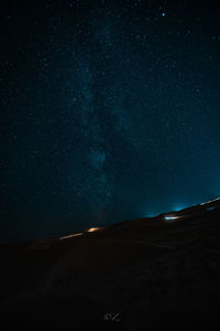 Scenic view of star field against sky at night