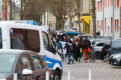 Vehicles on road along buildings