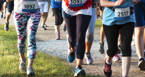 Low section of people running on land